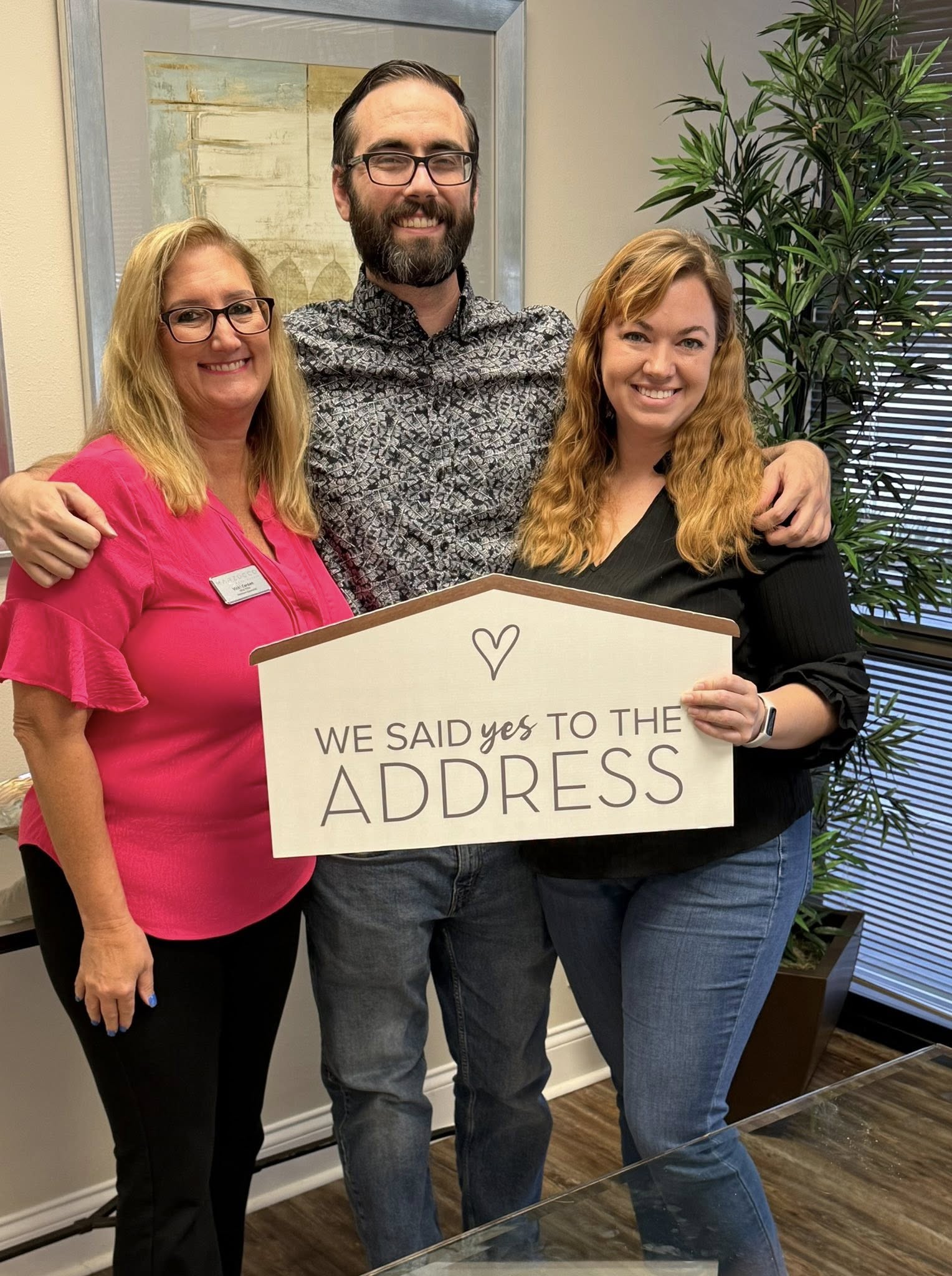 Vicki Carden celebrating with Florida home buyers after they said yes to the address